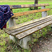 Bench with stylish autumn coat