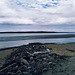 Nuages bleutés et plage déserte