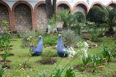 Mexico, San Cristobal de las Casas, Blue Chicks Flower Pots in the Garden of Merced