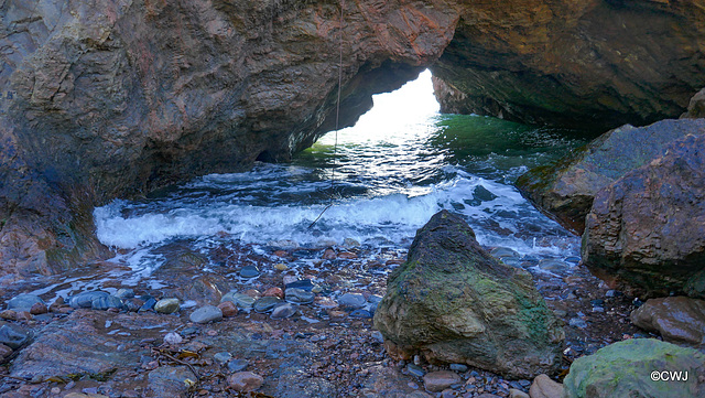 Rock formations at the bottom of the cliff patch down to McFarquhar's Cave