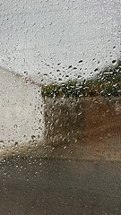 Penedos, kitchen window and rain