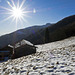 In backlight, from the rooftops of the hut to Monviso