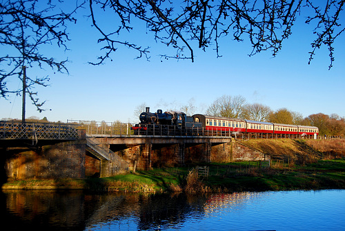 Locomotive 78018 crossing river Nene