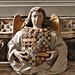 st mary's church, warwick (123)angel bearing heraldry of richard beauchamp and wife above the inner doorway to the chapel by samuel dunkley 1704