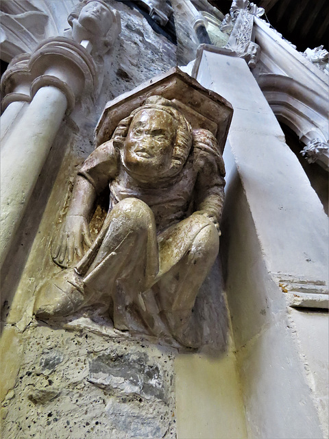 winchelsea church, sussex c14 atlas figure supporting a corbel on his back