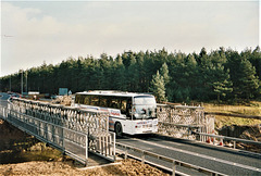 Ambassador Travel 100 (F100 BPW) on the A11 near Fiveways, Barton Mills – 16 Jan 1994 (213-7A)