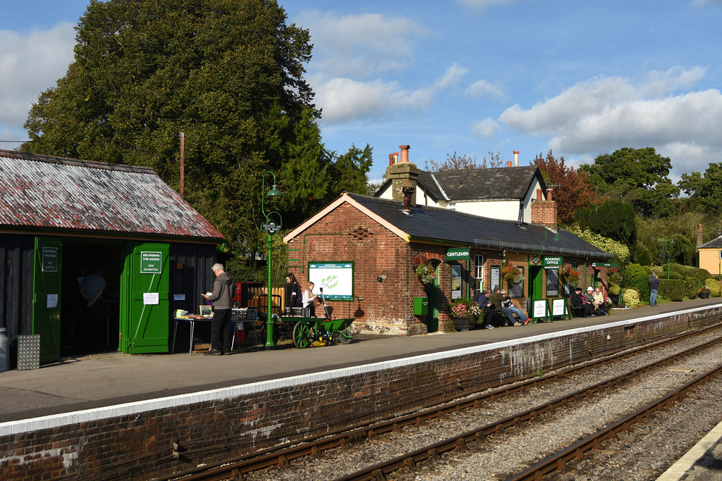 A Gentleman choosing books from a table on the station