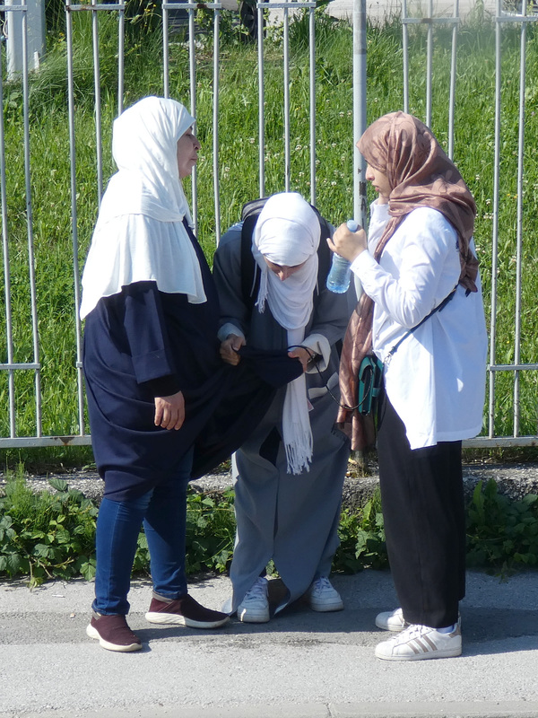 Three Ladies at the Bus Stop