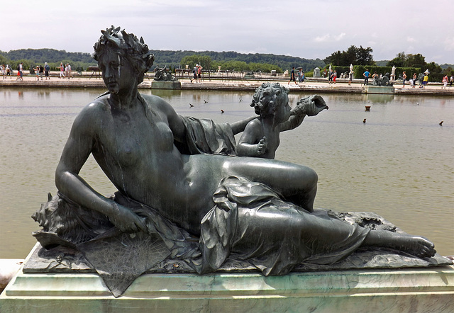 Nymph and Child Blowing on a Sea Shell Sculpture in the Gardens of Versailles, June 2013