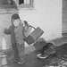 My elder brother feeding the cat, 1943.