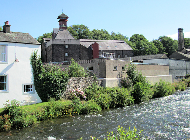 Cockermouth - River Cocker and Jennings Brewery behind.