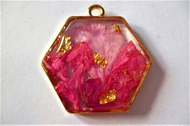 Pink and red geranium petals and gold leaf