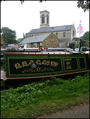 canalside church and flag