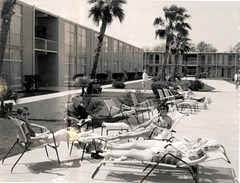 Slowly roasting family by the Hilton Pool, New Orleans, 1960.