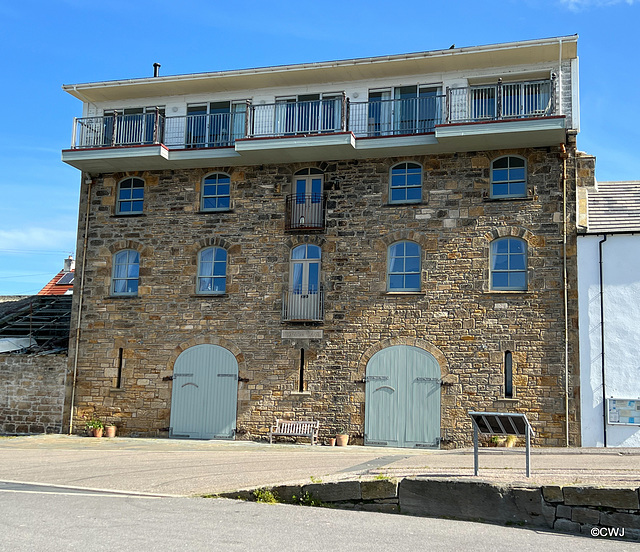 A Thomas Telford-designed store at Burghead Harbour, converted to a modern residence.