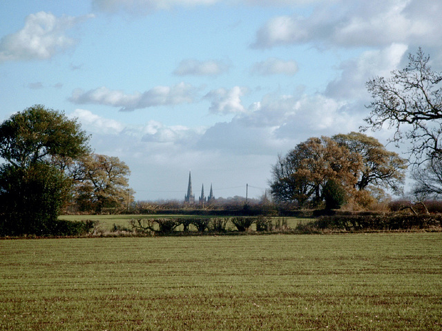The three spires of Lichfield Cathedral come into view from near The Abnalls.