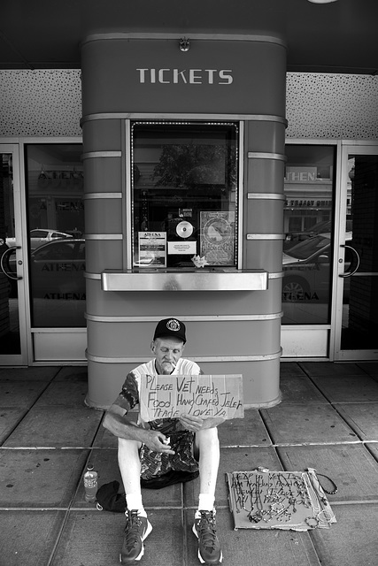 He hangs out in front of the Athena Theatre