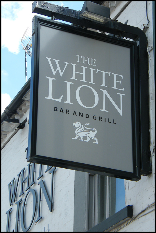 boring grey White Lion pub sign