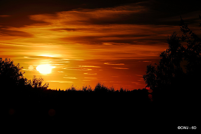 Lenticular Clouds against the setting sun