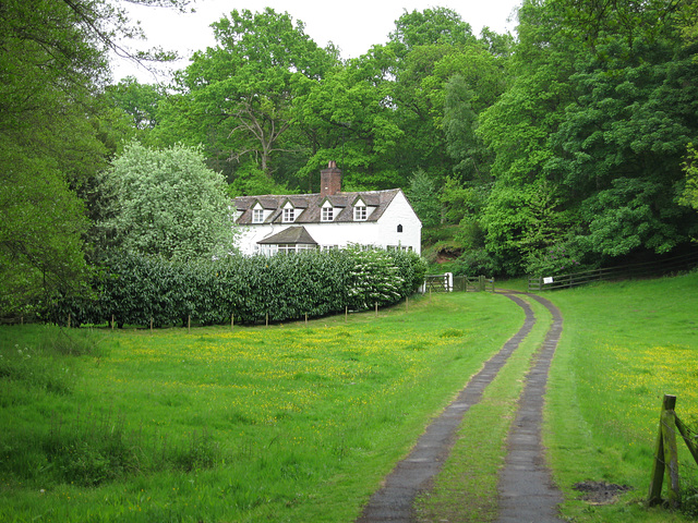 Cottages seen from the footpath near the weir on the River Worfe and Soudley Rocks