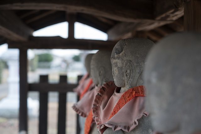 Stone statues with a bib