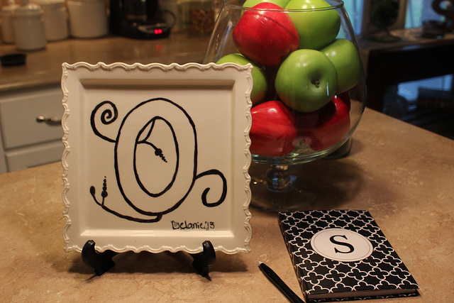 " O ",  painted onto a small plate by my 18 yr old G Daughter when she was 8 Yr old.  O and theres my other initial :)))