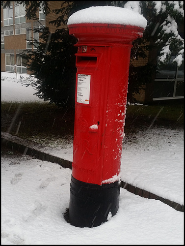 snow-topped pillar box