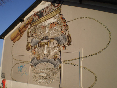 Mural by Vhils (the carving) and Pixel Pancho (the painting).