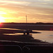 There were cars along the burrows road, parked so they could see the sunset