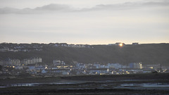 Looking towards Westward Ho!, with the sun catching the windows