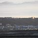 Looking towards Westward Ho!, with the sun catching the windows