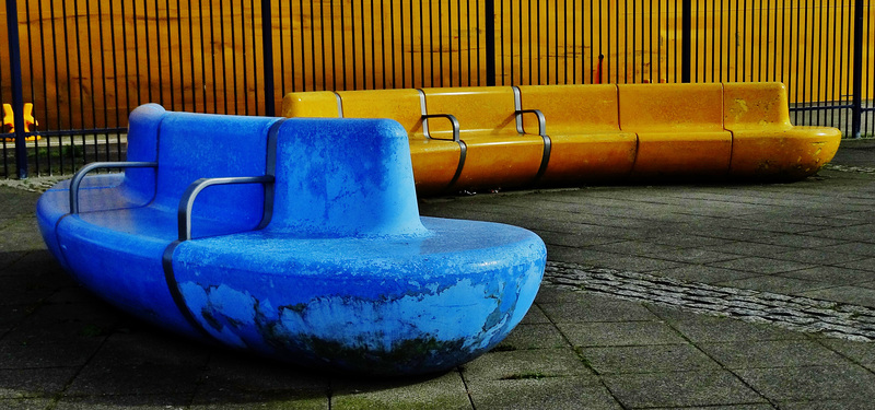 Yellow Tanker Docks Beside Matching Benches