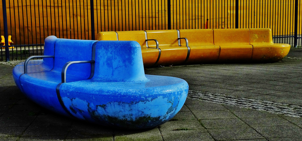 Yellow Tanker Docks Beside Matching Benches