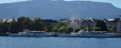 Genf am mit Riesenrad, und Dampfschiffen