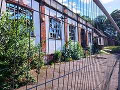 Fence around a very unhappy building!