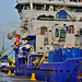 Docked along side a Dredger