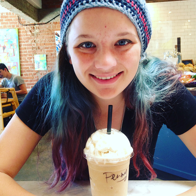 Happy teen with coffee drink