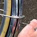Removing bolt allows lower fender to detach if more clearance is needed