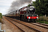 With a friendly wave from the footplate crew Stanier LMS class 6P Jubilee 4-6-0 45699 GALATEA with 1Z27 17.13 Scarborough - Crewe The Scarborough Spa Express at Weaverthorpe Crossing 15th August 2019. (Steam as far as York)