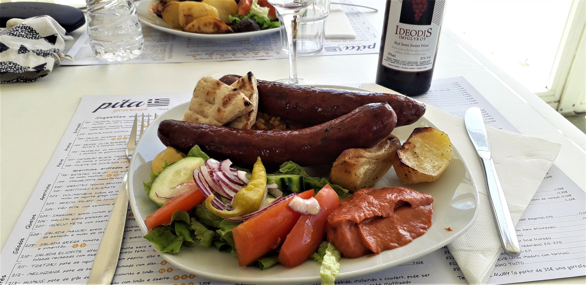 Greek meal of countryside sausages for lunch.