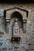 Italy, San Gimignano, Sculpture on the Wall of Collegiata di Santa Maria Assunta