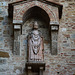 Italy, San Gimignano, Sculpture on the Wall of Collegiata di Santa Maria Assunta