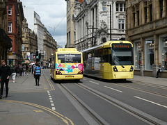 First Manchester 49111 (YJ60 KDV) and Metrolink 3070 in Manchester - 24 May 2019 (P1020066)