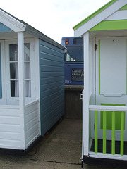 DSCF9849 First Norfolk and Suffolk 42914 (WX05 RVZ) seen between the beach huts at Southwold - 23 Sept 2017