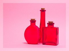 Still Life with Red Glass Bottles