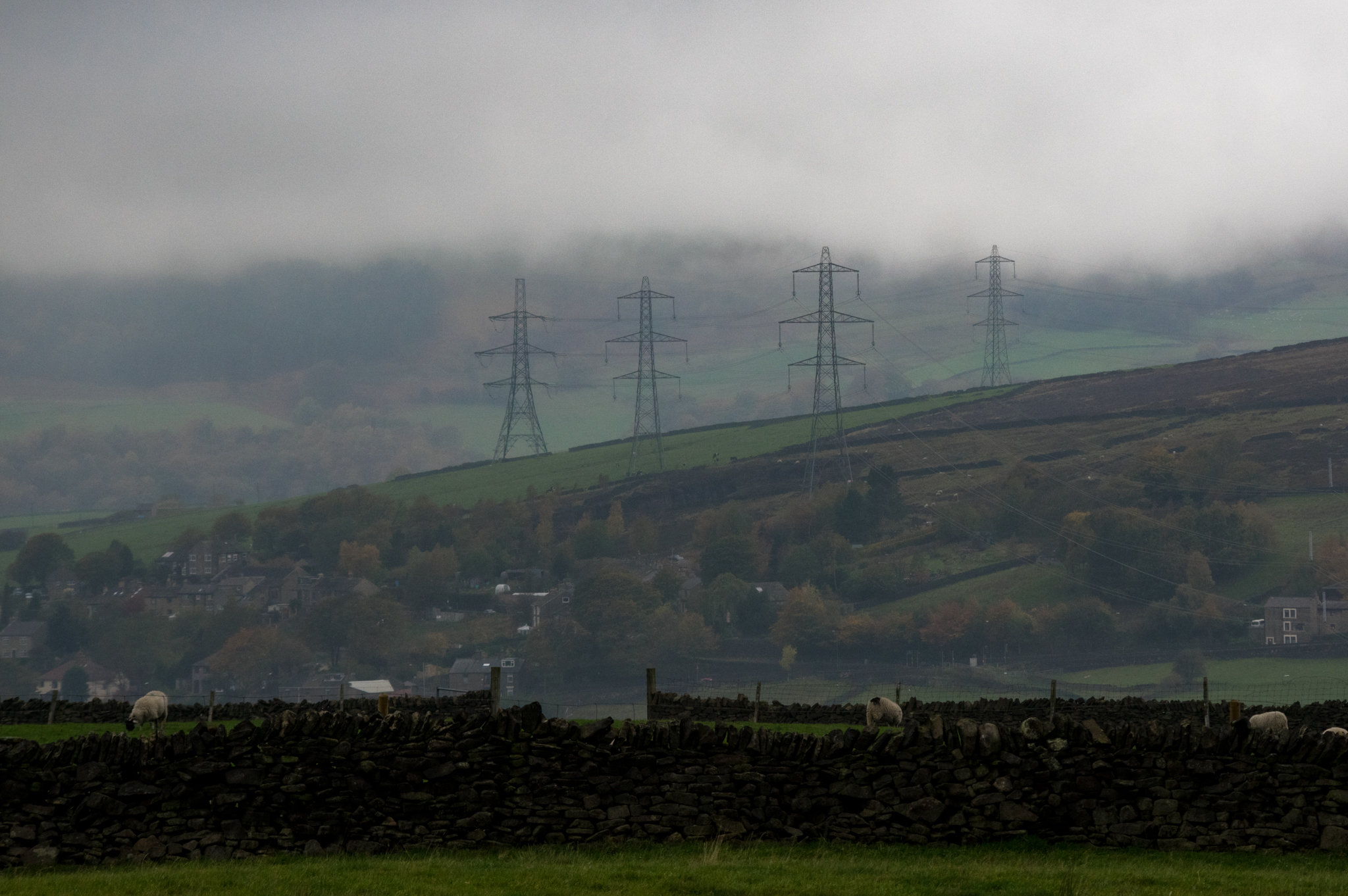 Tintwistle Pylons touching the clouds