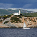 Lighthouse and yacht