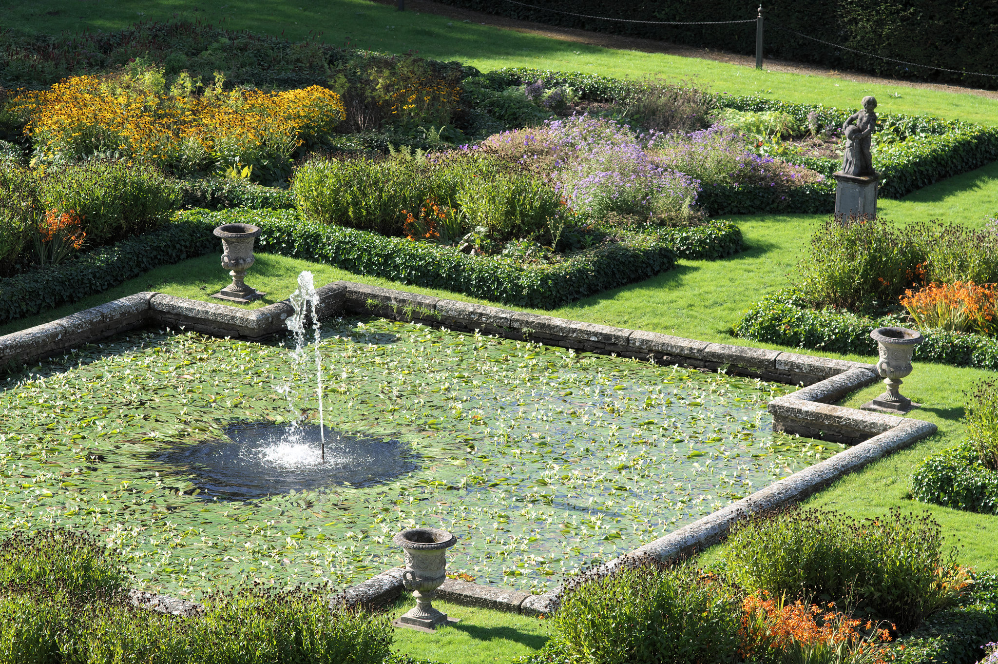 Ornamental pool with fountain statue at Lyme Park
