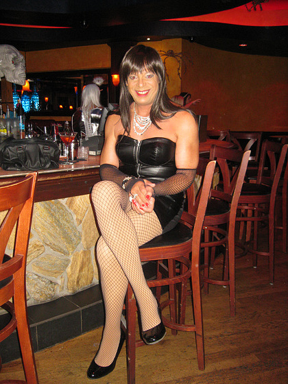 Leather strapless dress and fishnets