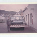 David Slater stood with Duncan MacLennan's  bus in Shieldaig (EJS 506D) - May 1967